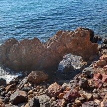 Arc with colorful stones in the Mediterranean Sea